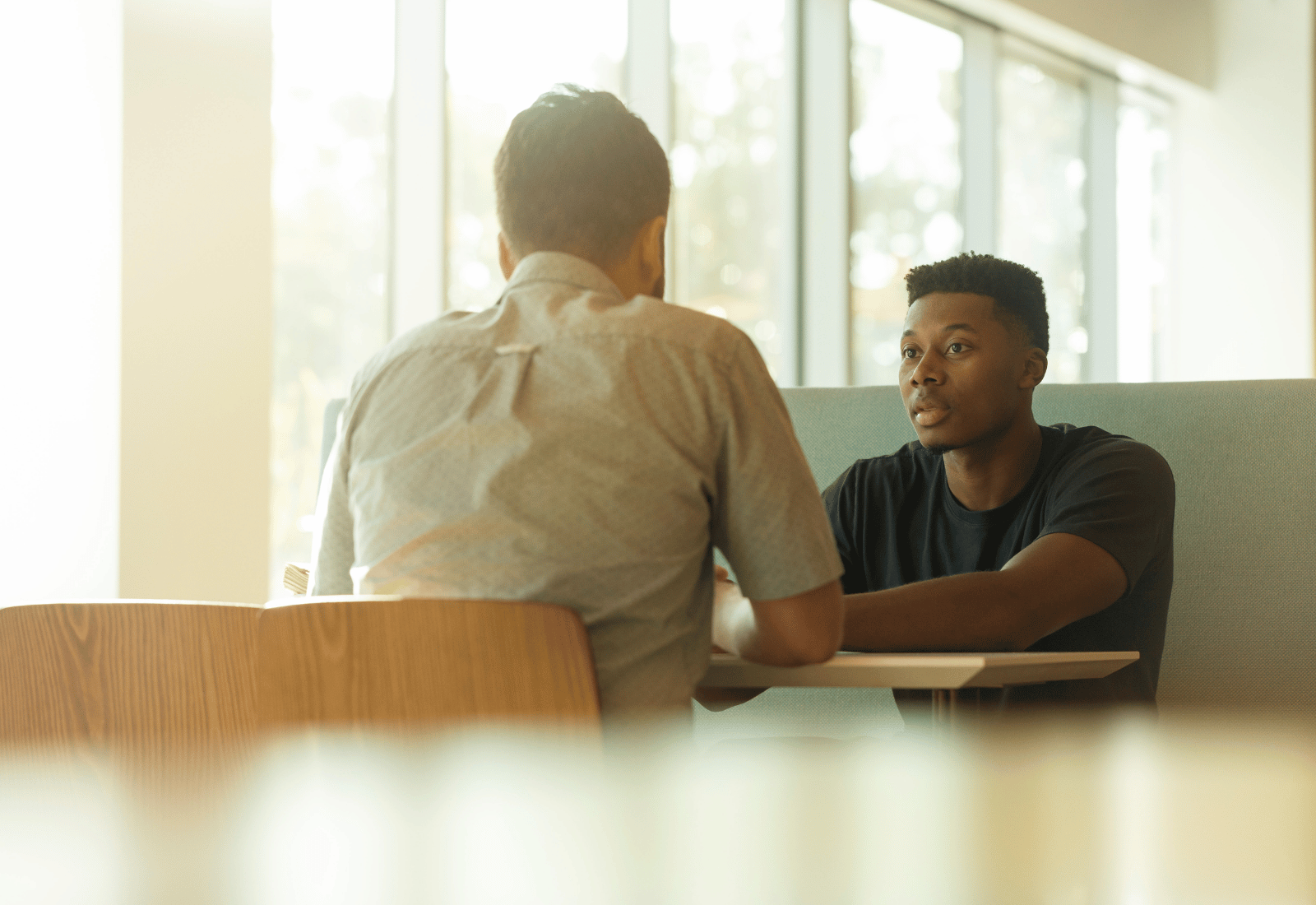 Sales manager discussing with sales rep about performance