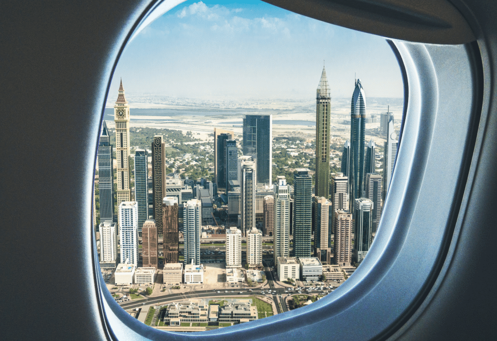 Airplane approaching Dubai skyline