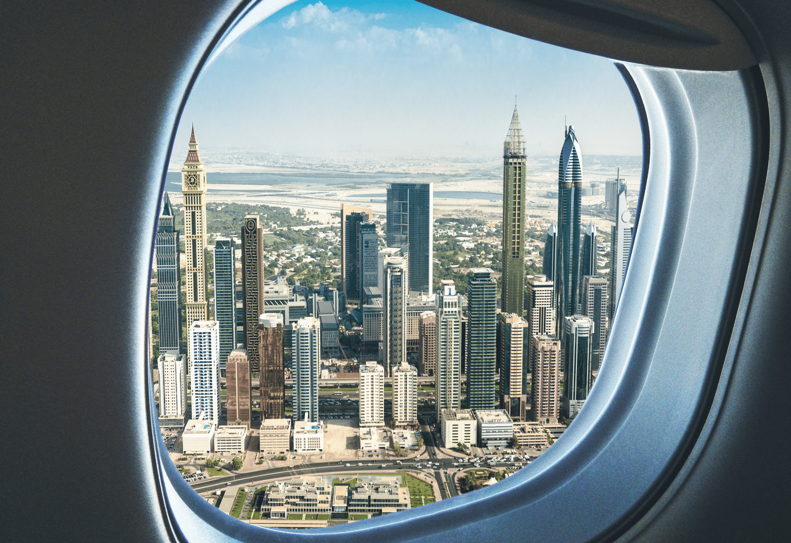 Airplane approaching Dubai skyline
